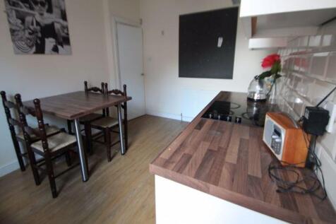 A modern, well-maintained kitchen area with a w...