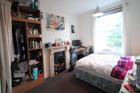 A bright and cozy double bedroom featuring a la...