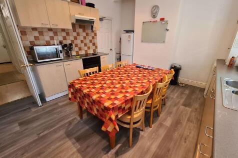 A well-maintained kitchen area featuring a chee...