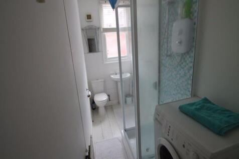 A clean and well-maintained bathroom with a sho...