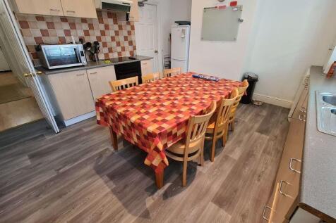 A well-maintained kitchen with a functional lay...