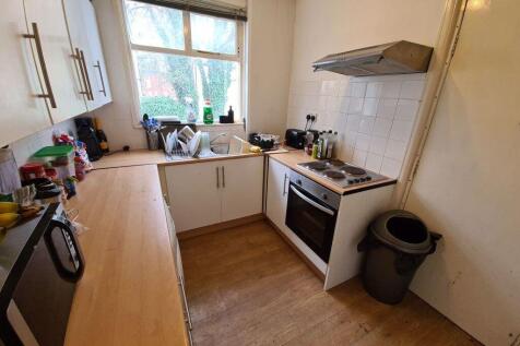 A functional kitchen area with ample counter sp...