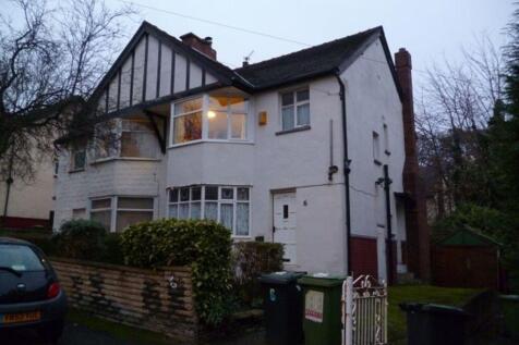 A charming front view of a traditional detached...