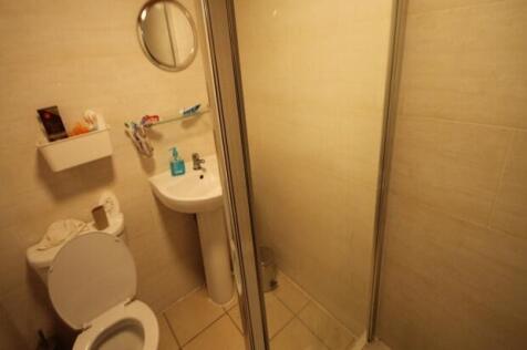 A clean and well-maintained bathroom with a sho...