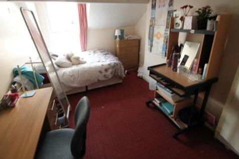 A cozy and well-maintained living room with nat...