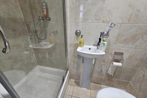 A clean and well-maintained bathroom featuring ...
