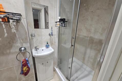 A clean and well-maintained bathroom featuring ...