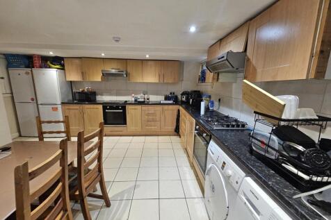 A bright and well-maintained kitchen with moder...