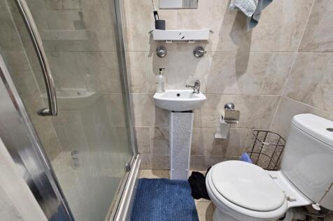 A clean and well-maintained bathroom with a sin...