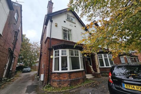 Exterior view of a traditional brick house with...