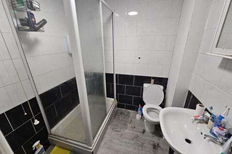 A well-maintained bathroom featuring a large sh...