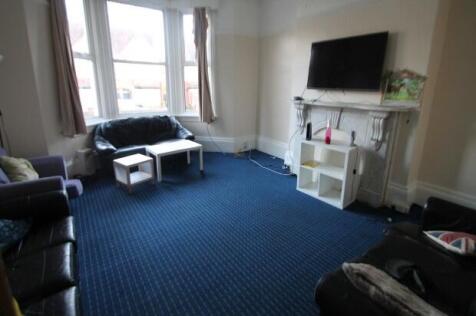 Bright and welcoming living room featuring a la...