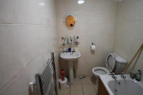 A clean and functional bathroom featuring a bat...