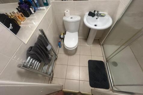 A clean, well-maintained bathroom featuring a t...