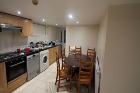 Bright and modern kitchen area with essential a...