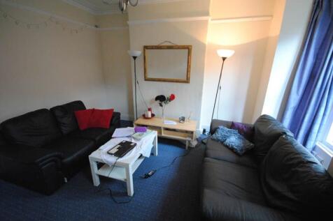 A cozy living room featuring two comfortable bl...
