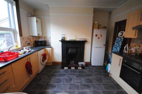 A well-maintained kitchen with ample counter sp...