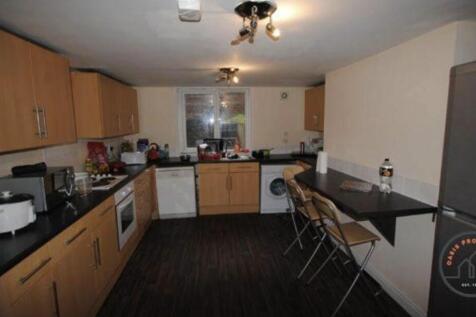 A well-equipped kitchen with ample counter spac...