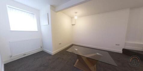 A bright and spacious contemporary living room ...