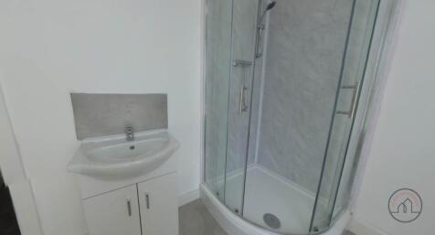 A clean and well-maintained bathroom featuring ...