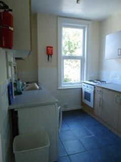 A bright and functional kitchen with a large wi...