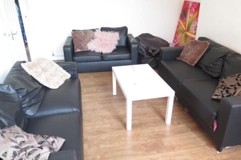 A spacious and inviting living room with contem...