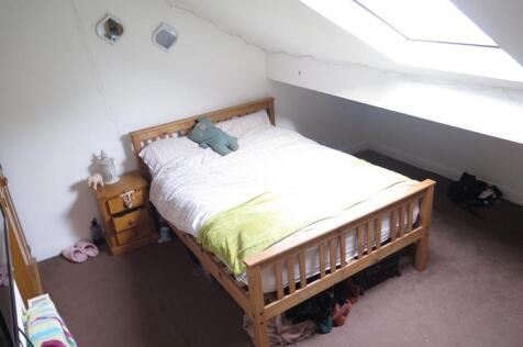 A bright and spacious master bedroom featuring ...