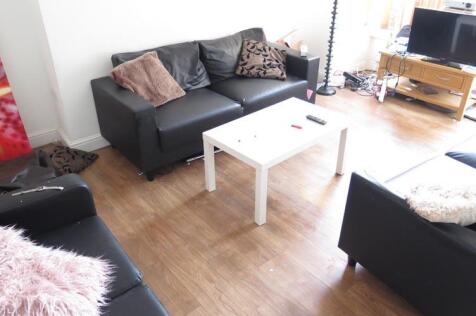 A bright and inviting living room featuring com...