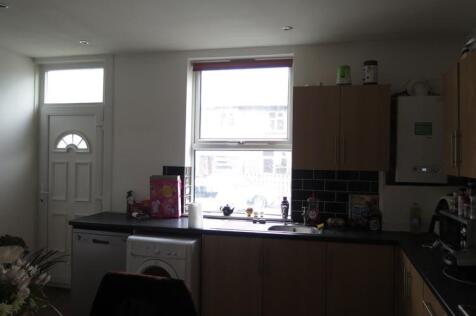 A cozy kitchen featuring a window that allows n...