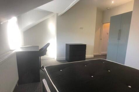 A clean and well-maintained small restroom with...