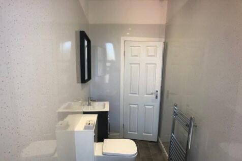 A clean and well-maintained bathroom featuring ...