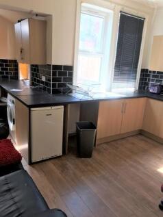 Bright and modern kitchen featuring ample works...