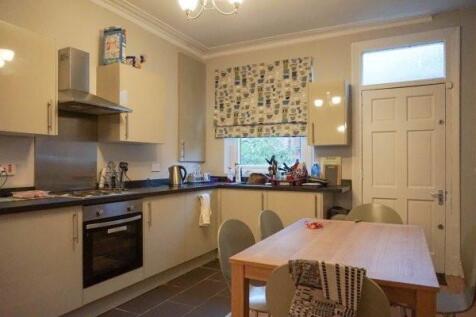 A cozy kitchen with functional appliances and a...