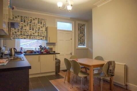 A bright and functional kitchen featuring ample...
