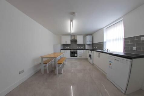 Bright and modern kitchen with ample natural li...