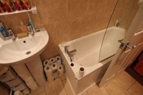 A clean and well-maintained bathroom featuring ...