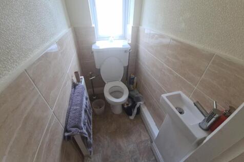 A spacious and well-maintained bathroom with a ...