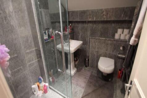 Bright and well-maintained bathroom with modern...