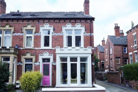 A charming Victorian-style house with well-main...