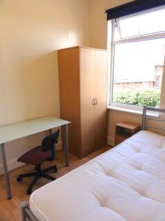 Bright and welcoming double bedroom featuring a...