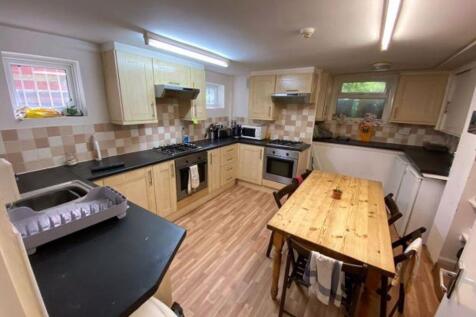 A bright and well-maintained kitchen with ample...