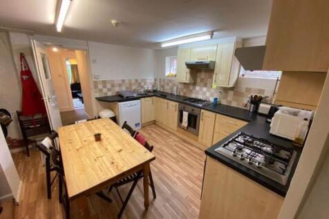 A well-maintained kitchen featuring a large din...