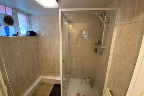 A clean and well-maintained bathroom with a spa...