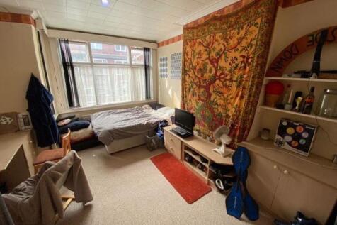 A cozy living room with natural light coming th...