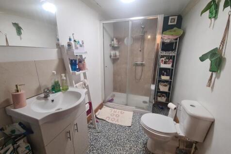 A clean and well-maintained bathroom with a spa...
