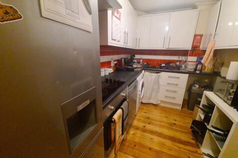 A modern, well-maintained kitchen featuring whi...