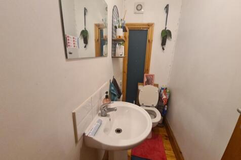 A spacious and well-maintained bathroom with a ...