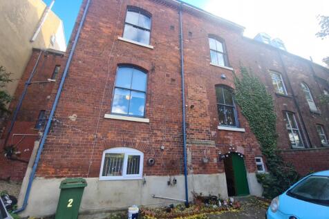 An exterior shot of a classic brick building wi...