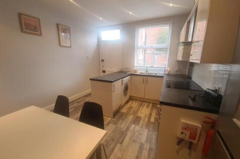 A bright and well-maintained kitchen with ample...