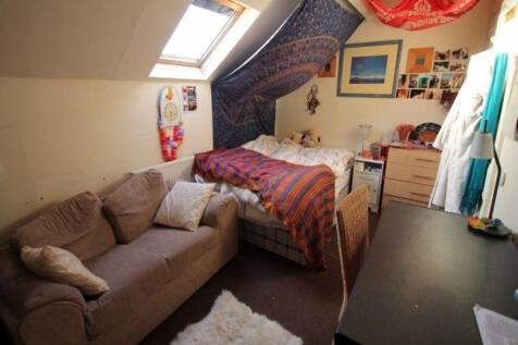 A cozy living room with a comfortable sofa, a w...